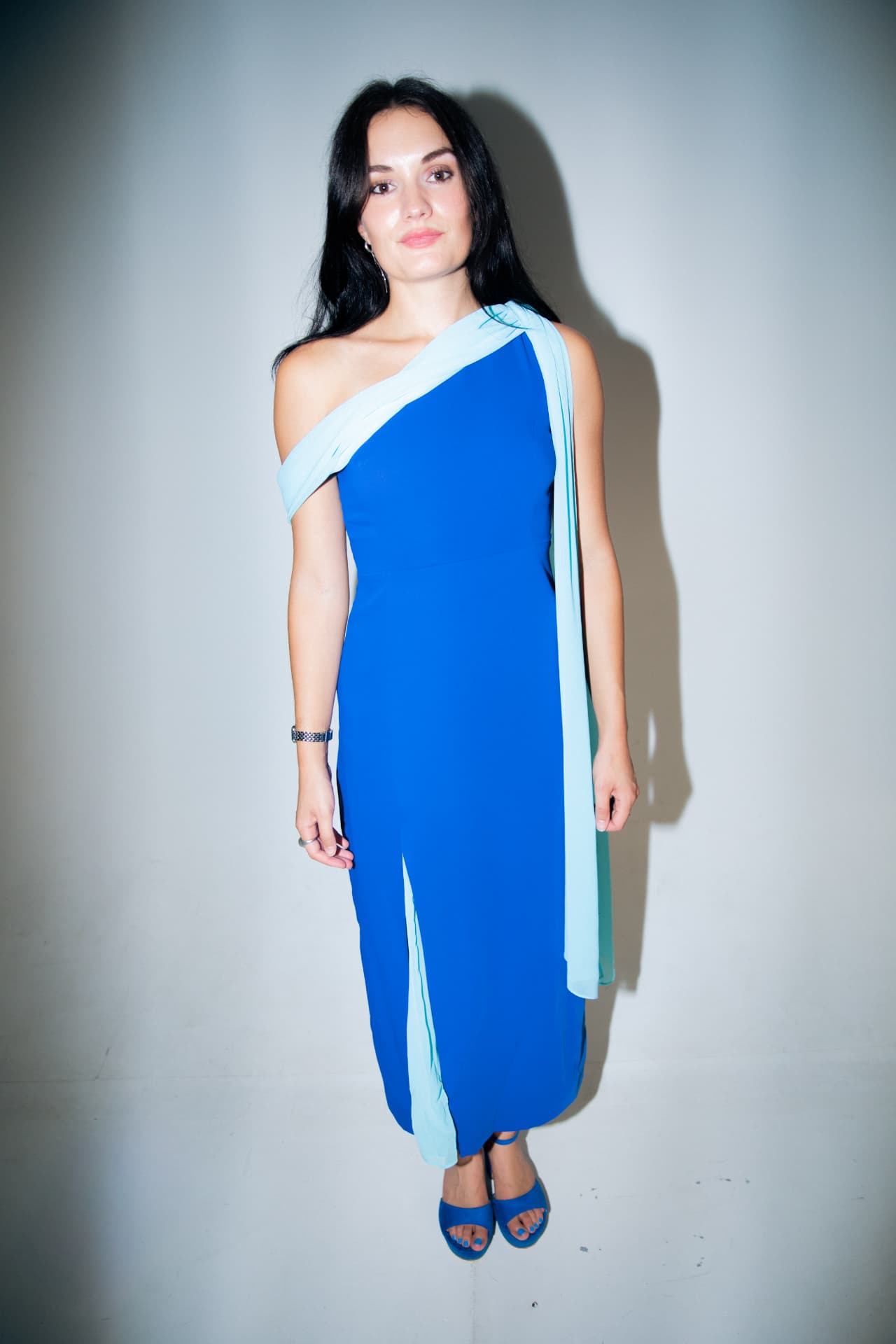 Woman in a cobalt and powder blue column dress